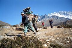 11 Tengboche To Dingboche - Porters Rushing Downhill With Nuptse South Face.jpg